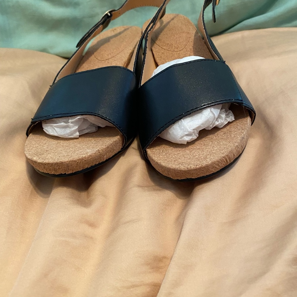 A brand new pair of sling back shirt heels size 7